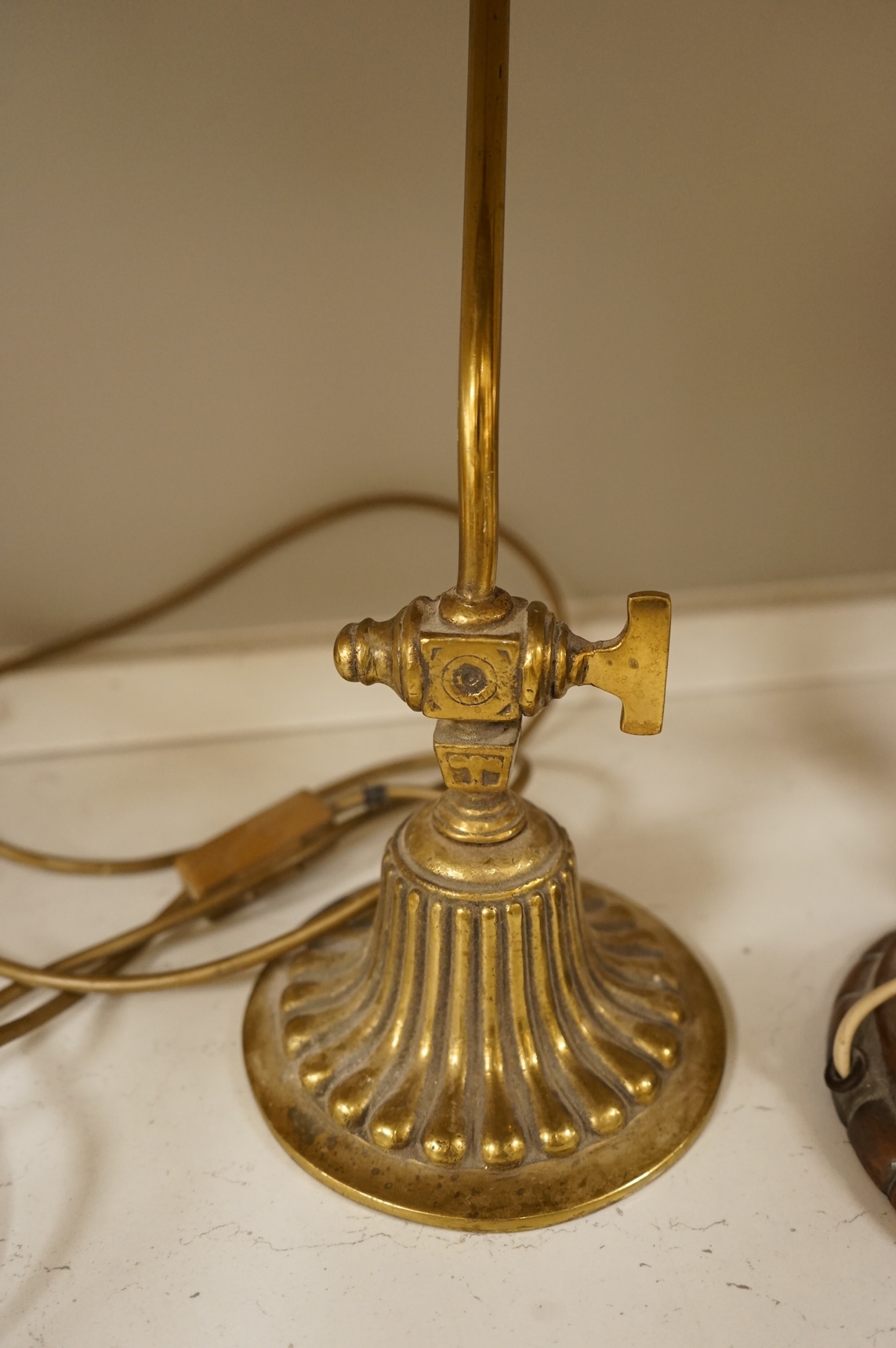 A copper table lamp and a brass students lamp